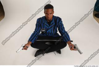 01 2018 01 GARSON SITTING POSE WITH GUNS